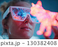 Neon VR glasses wearer engaged in interactive experience with glowing cat figurine 130382408