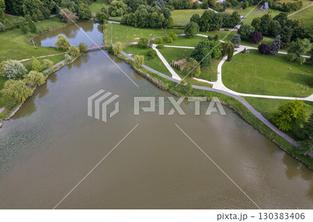 Aerial drone view over tranquil Boating lake in Nagykanizsa, Hungary. Aerial drone view over tranquil Boating lake in Nagykanizsa, Hungary. 130383406