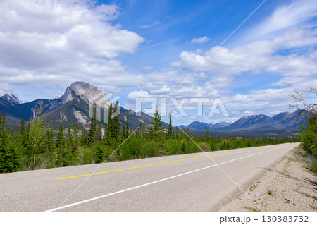 Scenic rout through mountains and forests, highway view. 130383732