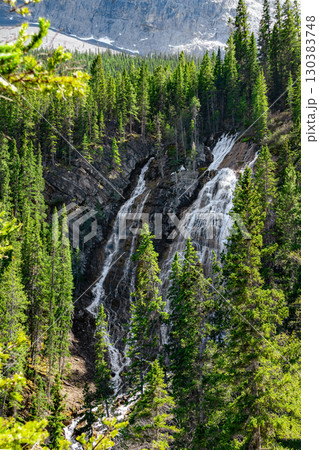 Waterfalls high in the mountains at the mountain peak among the forest. Waterfalls high in the mountains at the mountain peak among the forest. 130383748