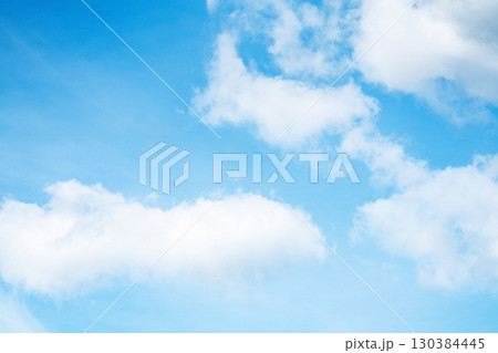 Bright blue sky with white clouds and sunlight Bright blue sky with white clouds and sunlight 130384445