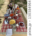 A table with a red and white checkered tablecloth 130384964