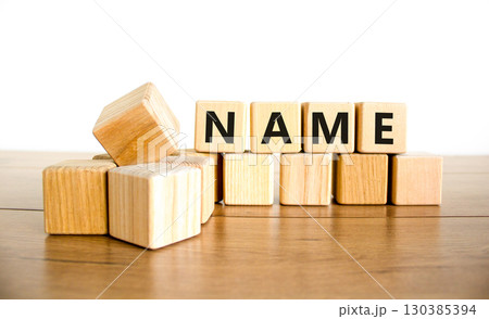 Name symbol. Concept word Name on beautiful wooden blocks. Beautiful wooden table white background. Business, lifestyle, support and name concept. Copy space. 130385394