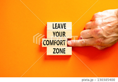 Leave your comfort zone symbol. Concept words Leave your comfort zone on beautiful wooden blocks. Beautiful orange paper background. Business psychological Leave your comfort zone concept. Copy space. 130385400