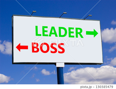 Leader or boss symbol. Concept word Leader or Boss on beautiful billboard with two arrows. Beautiful blue sky with clouds background. Business and leader or boss concept. Copy space. Leader or boss symbol. Concept word Leader or Boss on beautiful billboard with two arrows. Beautiful blue sky with clouds background. Business and leader or boss concept. Copy space. 130385479