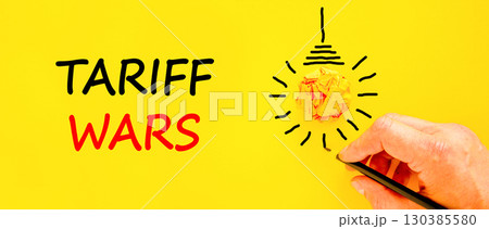 Trade tariff wars symbol. Concept word Tariff wars on beautiful yellow paper. Businessman's hand. Light bulb icon. Beautiful yellow paper background. Business trade tariff wars concept. Copy space. Trade tariff wars symbol. Concept word Tariff wars on beautiful yellow paper. Businessman's hand. Light bulb icon. Beautiful yellow paper background. Business trade tariff wars concept. Copy space. 130385580