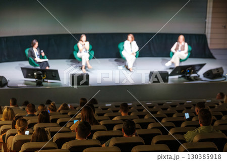 Panel discussion with audience in modern conference room setting Panel discussion with audience in modern conference room setting 130385918