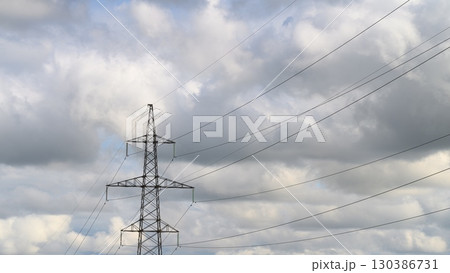 Power Lines Set Against a Dramatic Dynamic Cloudy Sky Creating a Unique Atmosphere 130386731