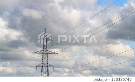 Power Lines Silhouetted Against a Dramatic and Cloudy Sky with Beautiful Overcast Effects Power Lines Silhouetted Against a Dramatic and Cloudy Sky with Beautiful Overcast Effects 130386740