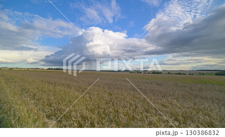 A Serene Landscape Bathed in Natural Beauty Under Dramatic and Spectacular Clouds 130386832