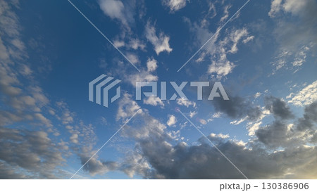 Explore the Exquisite Cloud Patterns Beautifully Luminous Beneath a Clear Blue Sky 130386906