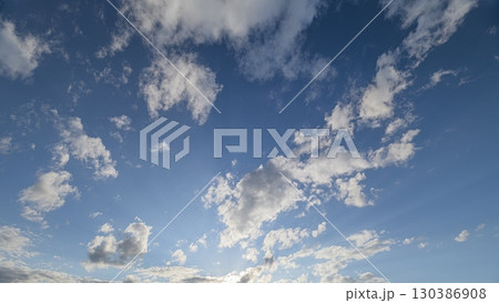 A Beautiful Sky Filled with Fluffy Clouds and Rays of Sunlight Bringing Warmth and Joy A Beautiful Sky Filled with Fluffy Clouds and Rays of Sunlight Bringing Warmth and Joy 130386908