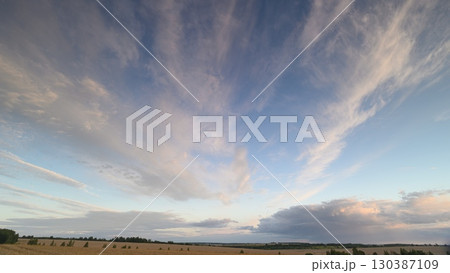 A Stunningly Beautiful Horizon Featuring Dramatic Skies Filled with Fluffy Clouds Above 130387109