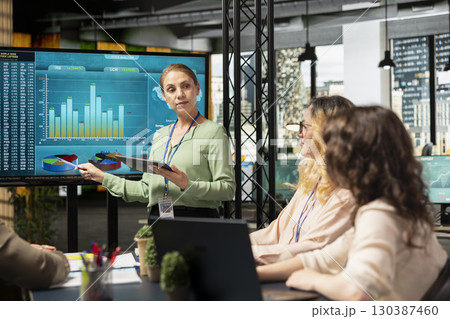 Team of office workers using performance data analysis to build a strategy in a competitive business industry, women empowerment for accelerate project goals through efficient planning. 130387460