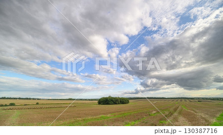 An Expansive Landscape Showcasing a Beautiful Scene Under a Dramatic and Striking Sky An Expansive Landscape Showcasing a Beautiful Scene Under a Dramatic and Striking Sky 130387716