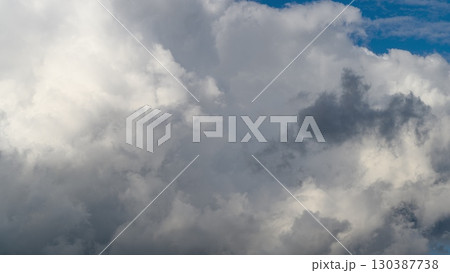 Witness the Dynamic Cloud Formation in a Beautiful Bright Blue Sky full of Life and Motion 130387738