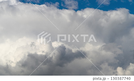 The Dynamic Cloud Formation Stands Out Beautifully Against a Bright Blue Sky Above The Dynamic Cloud Formation Stands Out Beautifully Against a Bright Blue Sky Above 130387740
