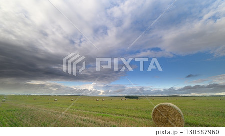 A Serene Countryside Scene Under Dramatic Skies Filled with Dynamic Clouds and Beauty A Serene Countryside Scene Under Dramatic Skies Filled with Dynamic Clouds and Beauty 130387960