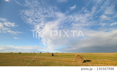 A Vast and Beautiful Landscape Under a Dynamic and EverChanging Sky Above, Full of Colorful Clouds A Vast and Beautiful Landscape Under a Dynamic and EverChanging Sky Above, Full of Colorful Clouds 130387996