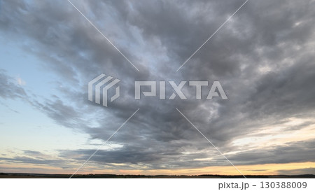 Dynamic Cloud Formation at Sunset A stunning display of natures evolving beauty and colors 130388009