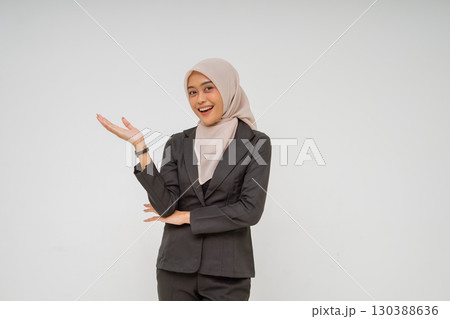 Confident Businesswoman Gesturing While Dressed in Professional Attire and Style 130388636