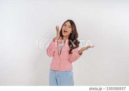 A Young Woman Conveying Her Excitement Through Casual Attire and Expression A Young Woman Conveying Her Excitement Through Casual Attire and Expression 130388937