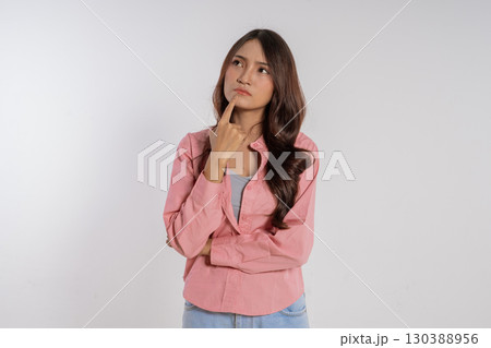 A Thoughtful Woman Engaging in Deep Pondering with Curiosity and Emotional Expression A Thoughtful Woman Engaging in Deep Pondering with Curiosity and Emotional Expression 130388956
