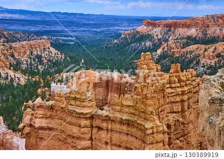 Bryce Canyon Hoodoo Formations Pine Forest and Distant Mesas Under Blue Sky Bryce Canyon Hoodoo Formations Pine Forest and Distant Mesas Under Blue Sky 130389919