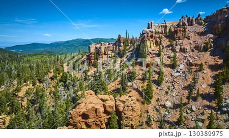 Aerial Blowhard Mountain Red Rock Formations and Pine Trees in Utah 130389975