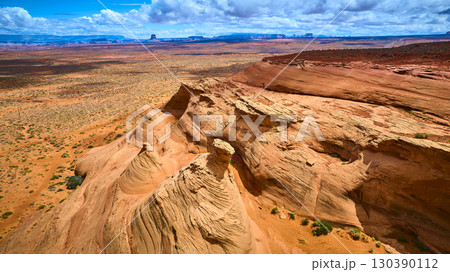 Aerial Sandstone Formations and Desert Plains with Distant Mesas Fly Over Aerial Sandstone Formations and Desert Plains with Distant Mesas Fly Over 130390112