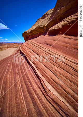 Sweeping Sandstone Striations and Desert Landscape in Motion Low Angle Sweeping Sandstone Striations and Desert Landscape in Motion Low Angle 130390141