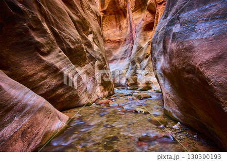 Sandstone Slot Canyon Flowing Stream and Reflections Low Eye Level Perspective 130390193