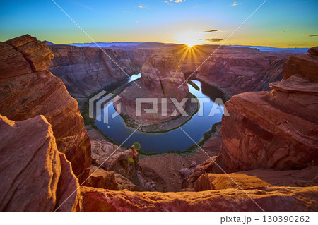 Horseshoe Bend Colorado River and Sunlit Sandstone Cliffs at Sunset Overlook Horseshoe Bend Colorado River and Sunlit Sandstone Cliffs at Sunset Overlook 130390262