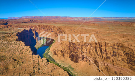Aerial Glen Canyon Colorado River Winding Through Red Desert Landscape Aerial Glen Canyon Colorado River Winding Through Red Desert Landscape 130390389