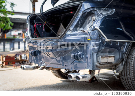 Checking car body work fiber bumper at car garage 130390930
