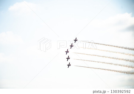 A formation of five aircraft performing display and aerobatics A formation of five aircraft performing display and aerobatics 130392592