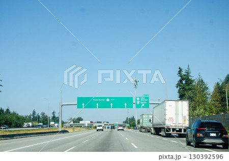 Road signage pointing US Border direction 130392596