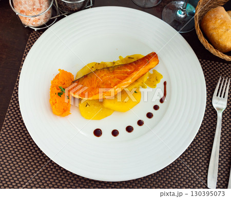 Salmon with potato and sweet potato puree 130395073