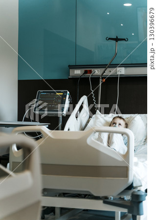 Child Patient Lying in Hospital Therapy Room Child Patient Lying in Hospital Therapy Room 130396679