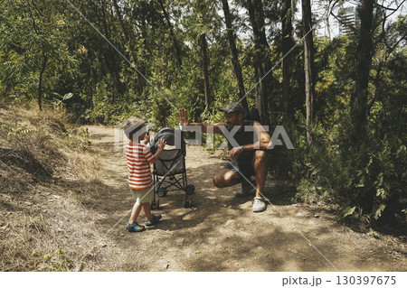 Father and Toddler Spending Time in Summer Forest 130397675