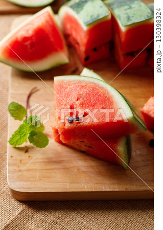 Slices of fresh watermelon on rustic wooden background. Slices of fresh watermelon on rustic wooden background. 130398324