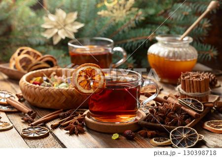 Christmas herbal tea with ingredients on a old wooden table. 130398718