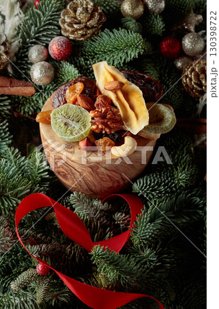 Dried fruits and Christmas wreath. 130398722