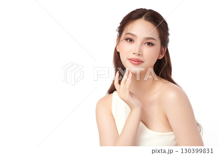 A beautiful young Asian woman with clean, fresh skin against a white background. Skincare, facial treatment, cosmetology, beauty, and spa. An elegant portrait of an Asian woman. A beautiful young Asian woman with clean, fresh skin against a white background. Skincare, facial treatment, cosmetology, beauty, and spa. An elegant portrait of an Asian woman. 130399831