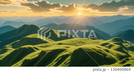 Green hills in the morning with the sun rising on the horizon 130400069