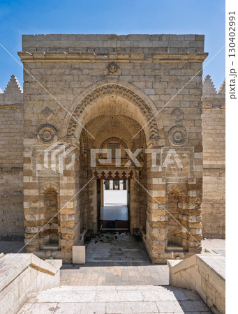 Majestic historic arched entrance of Al-Zahir Baybars Mosque in Cairo, Egypt. Majestic historic arched entrance of Al-Zahir Baybars Mosque in Cairo, Egypt. 130402991