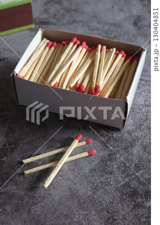 Open wooden matchbox on a dark background Open wooden matchbox on a dark background 130404851