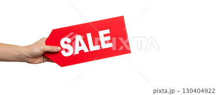 Hand holding a bright red sale tag on a white background with copy space. Shopping and retail promotion concept. Hand holding a bright red sale tag on a white background with copy space. Shopping and retail promotion concept. 130404922