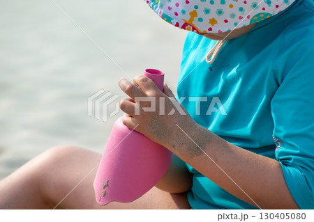 Child playing on a beach, good activity and sport for health and mental health Child playing on a beach, good activity and sport for health and mental health 130405080
