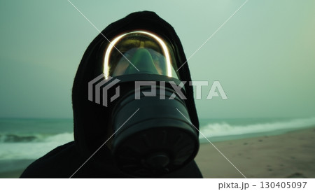 World Contaminated By Radioactive Particles Man Breathes With Gas Mask On Beach World Contaminated By Radioactive Particles Man Breathes With Gas Mask On Beach 130405097